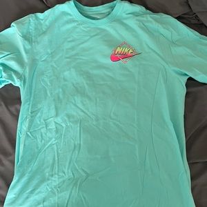 Turquoise Nike T-Shirt with a cool back design!